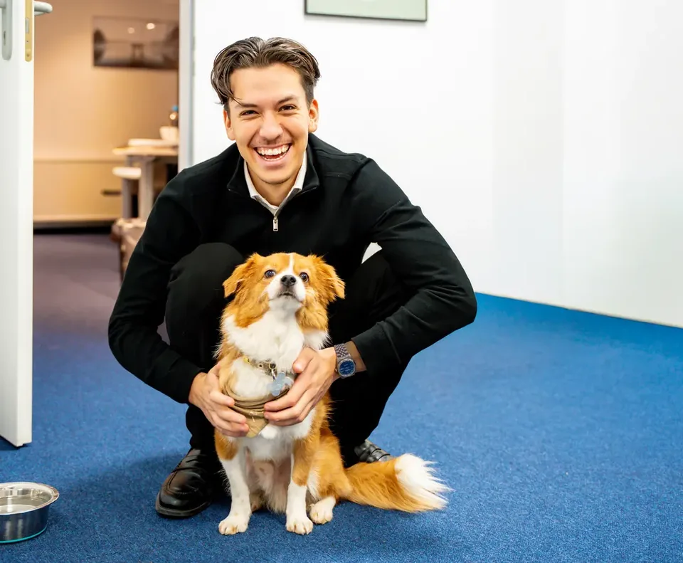 Office dog and colleague